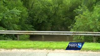 Two girls quickly carried down flooded creek