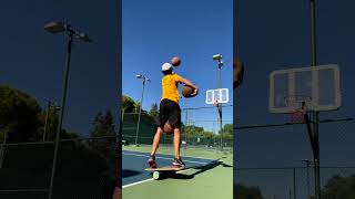 Guy Makes Basketball Trickshots While Balancing Himself on Rola-Bola and Exercise Ball - 1432685-2