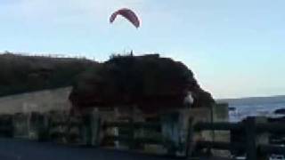 Man Jumps Off Cliff with Parachute