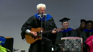 Eric Olson, Ph.D., Performs Original Song at Graduation