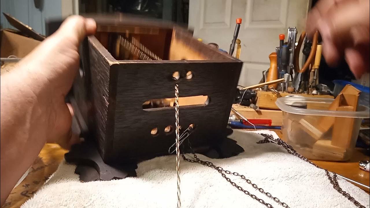 Installing cuckoo clock chains while movement is inside case or outside