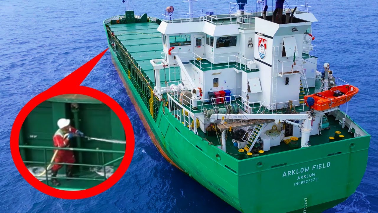 WASHING DOWN A SHIP Whilst At Sea Watch As Deckhands Clean Their washing-down-a-ship-whilst-at-sea-watch-as-deckhands-clean-their