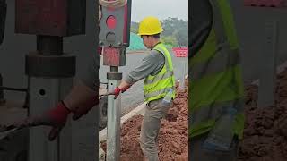 Road Guardrail Post Setup on New Road - Good tools and machinery make work easy