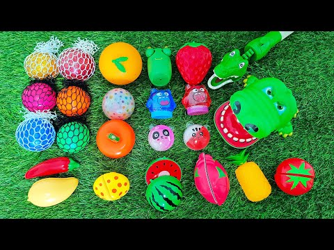 Feeding toy crocodile with toy fruits and vegetables - buah dan sayuran