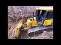 Bulldozer Breaking New Ground in a Dry Forest Path
