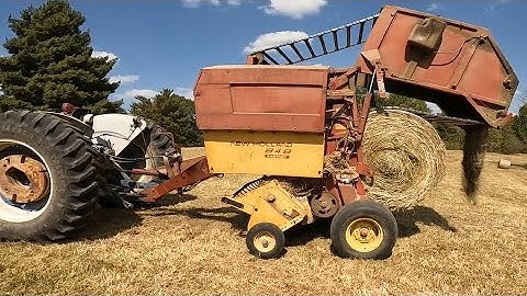 Rolling a A Bale Down the Hill to End Hay Season