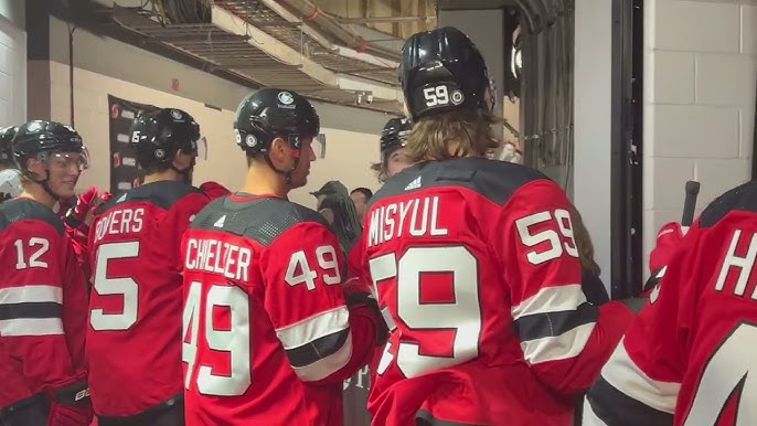 New Jersey Devils Bruce Driver reaches out to fans during a