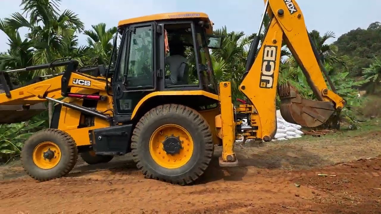 Jcb 3dx front bucket dozing and moving huge soil 