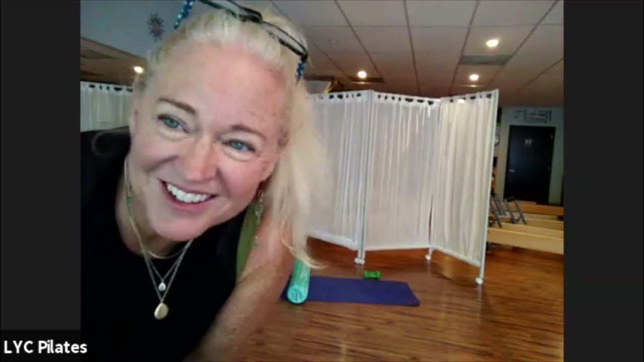 Pilates mat with foam roller. Taught by Cyndie Klein at Love Your Core