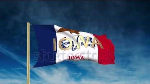 iowa flag slider style with title. Waving in the wind with cloud background animation Stock video