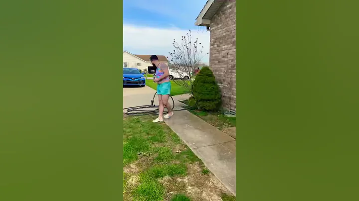 The kids give the dog a bath