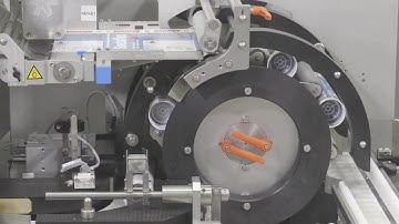 HERMA 242M S - Wrap-around labeller of jam capable cylindrical silicone cartridges