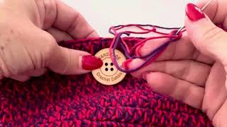 How to sew a button on to a crochet bag and to create the button loop