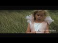 Beautiful Flower Girl Walking through a Field in a Perfect Dress | Butterfly Dress by SBA Bridal