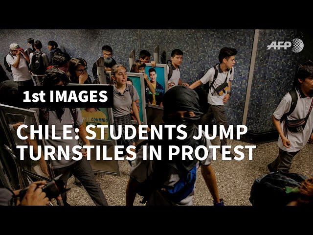 Chile students jump subway turnstiles as crisis continues | AFP class=