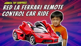 Jamie gets a red ferrari remote control car, and unboxes it. see him
his sisters around. putting together first car.