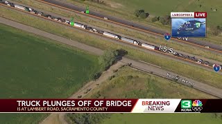 LiveCopter 3 shows big rig crashed over an overpass on I-5 in Sac County