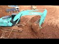 KOBELCO SK260lc loading dump trucks- Excavator working dirt digging
