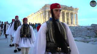 The Acropolis of Athens.  Elite Greek soldiers lowering the flag at sunset.