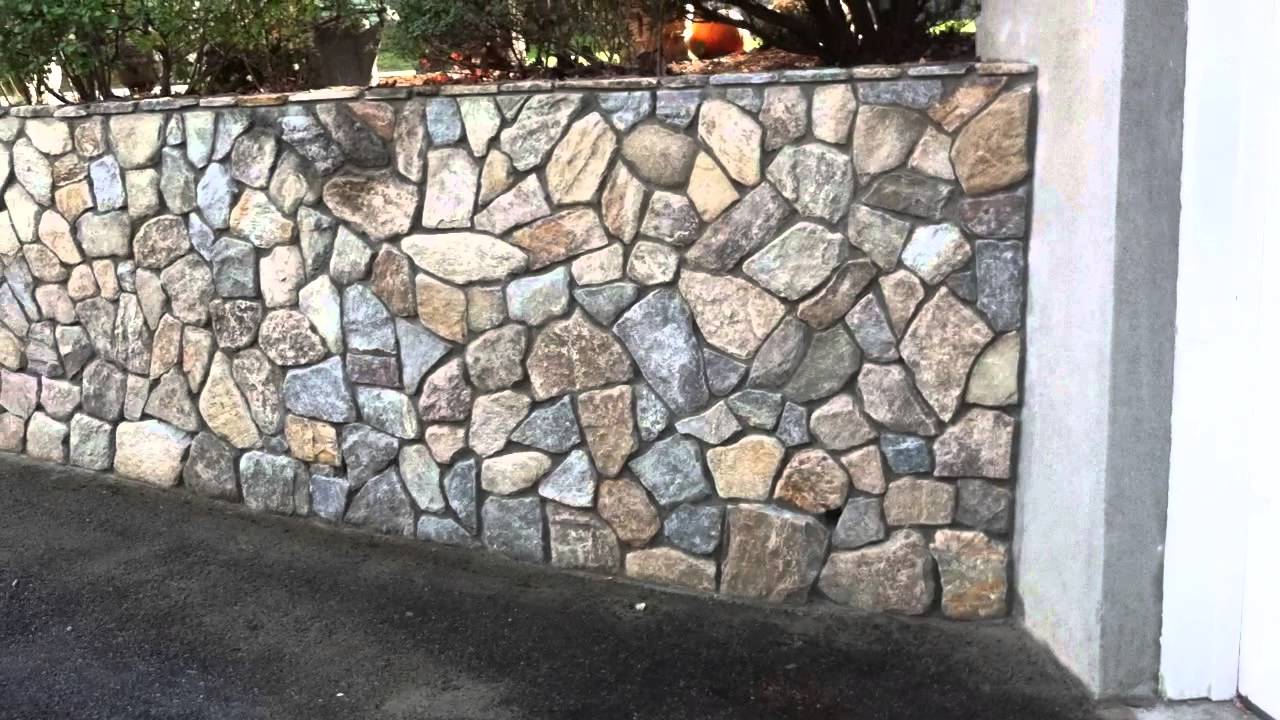 Stone Veneer over poured concrete wall - YouTube