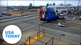Train collides with SUV stuck on tracks in Utah | USA TODAY