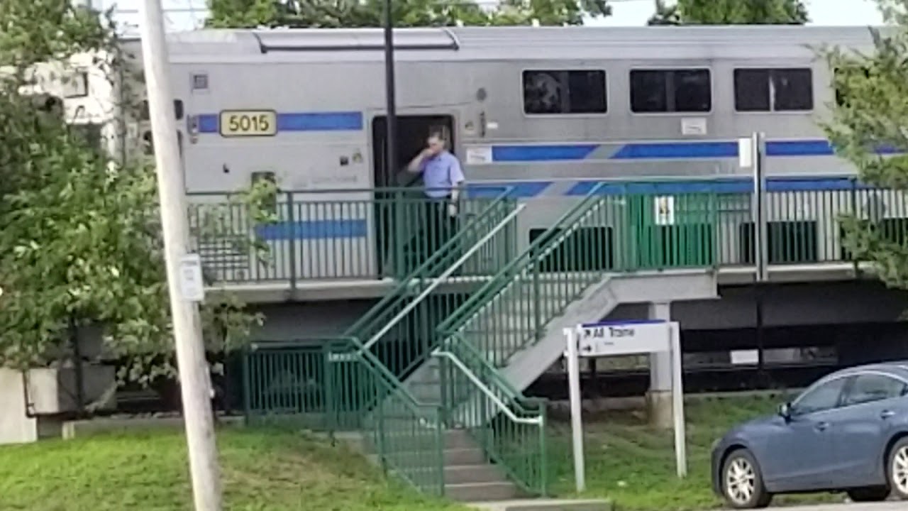 ENGINEERS TALKING LIRR TRAIN DEPARTING WEST FROM OYSTER BAY STATION