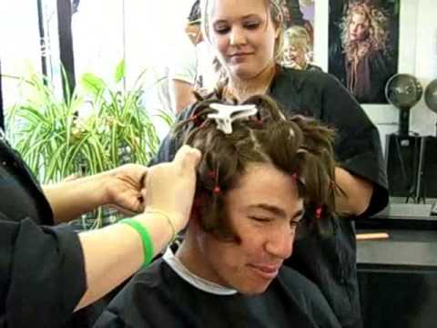 Brockton firefighter gets long hair cut off for charity