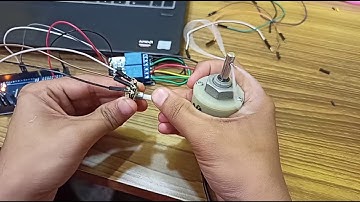 Write a program Arduino IDE to control DC motor direction based on potentiometer (POT) analog input.