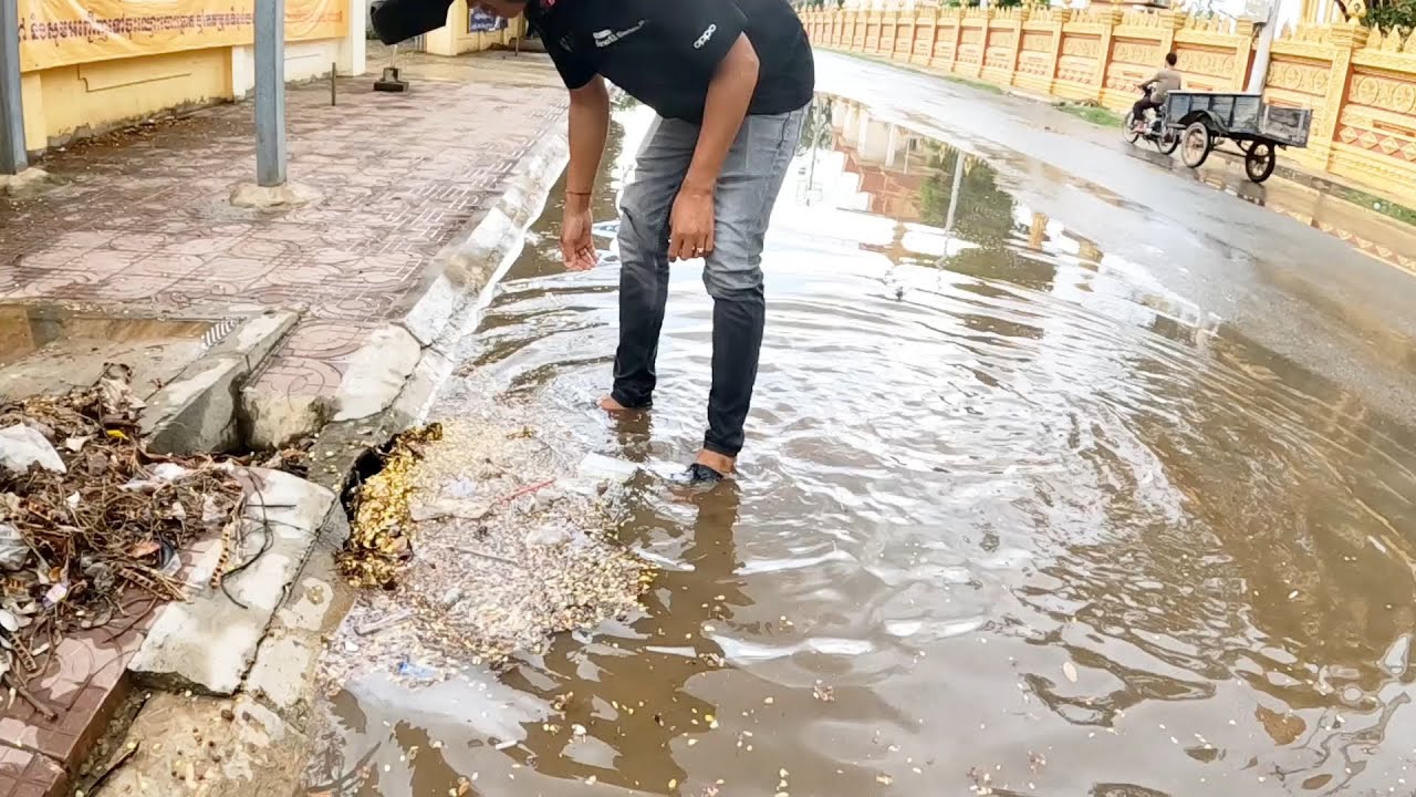 After Rain, Unclogging Drain Rain On The Street Road - YouTube