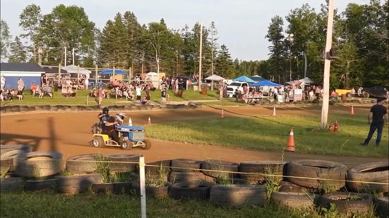 Wild lawn mower racing with spinouts and loose hoods,Richmond Corner,NB