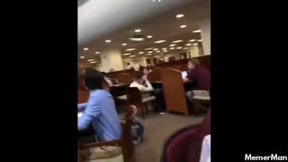 Guy releases balloon in library