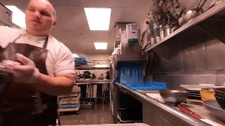 THE DISHWASHER AND A COUNTERTOP FULL OF DIRTY DISHES IN A RESTAURANT BAR MINIMUM WAGE WORK #66