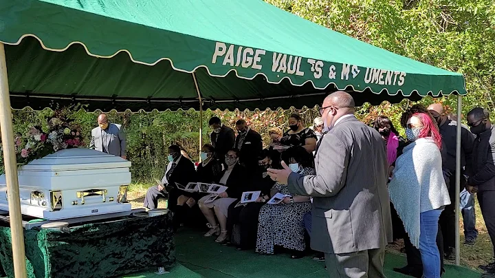 Minister Ty Blocker prays at Aunt Ethel Hamilton's...