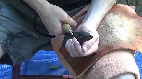 Flintknapping, notching large obsidian spear point    Time Laps
