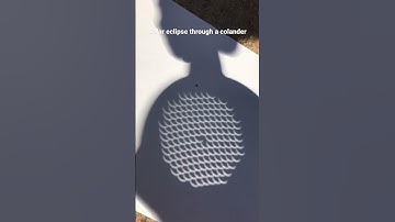 Solar eclipse through a colander
