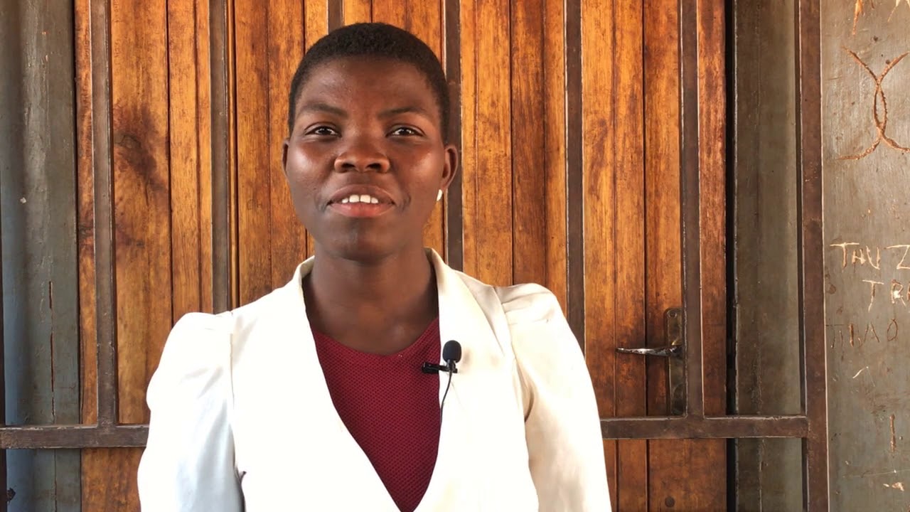 Volunteer literacy specialist support teacher Mary Phiri introduces herself