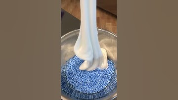 Mixing foam beads into slime!