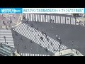 渋谷スクランブル交差点の原寸大セットを公開 映画やMVのファンらが“ロケ地の巡礼”(2023年10月14日)