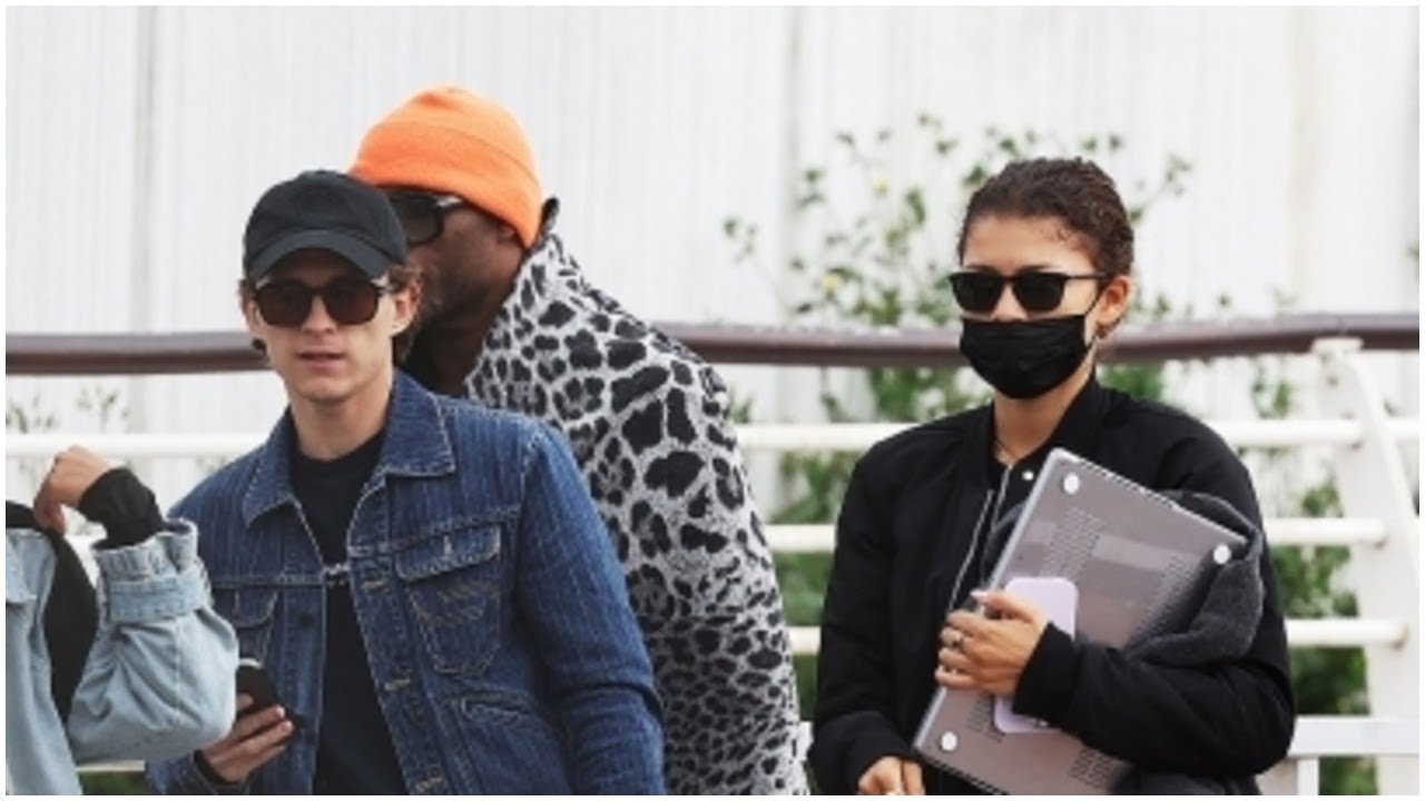 Tom Holland Carries Zendaya's $4K Louis Vuitton Bag Leaving Venice