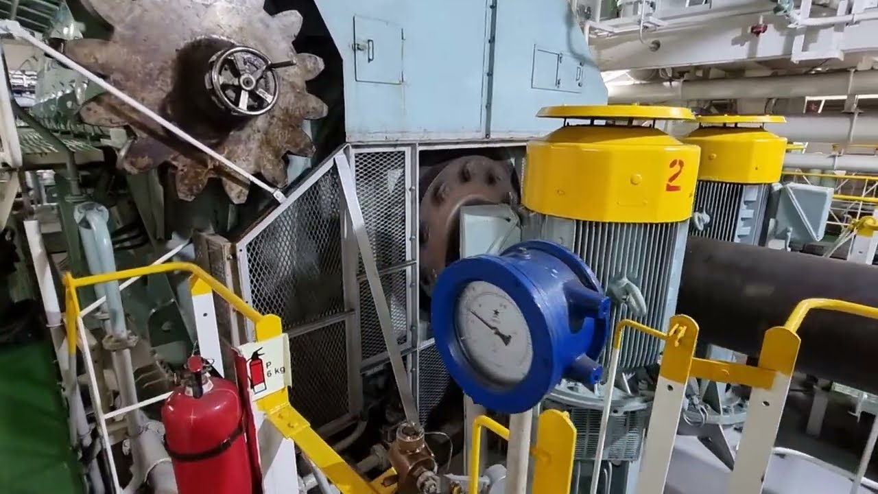 The massive 9 cylinder Hyundai - MAN B&W 9L60MC-C7 ship engine with 24000 Hp running at full speed