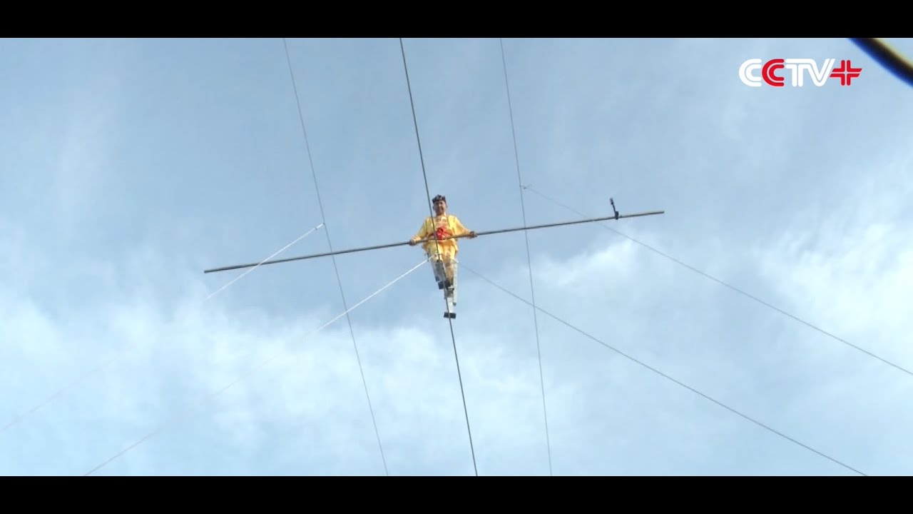 Chinese Stilt Walker Succeeds in High Wire Challenge YouTube