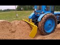 Proto 1 of 4 (in action): heavy duty 3 point hitch dump bucket designed for mid size tractor