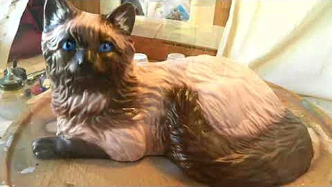 Watch the video about Painting a Himalayan Siamese theme on long haired ceramic cat