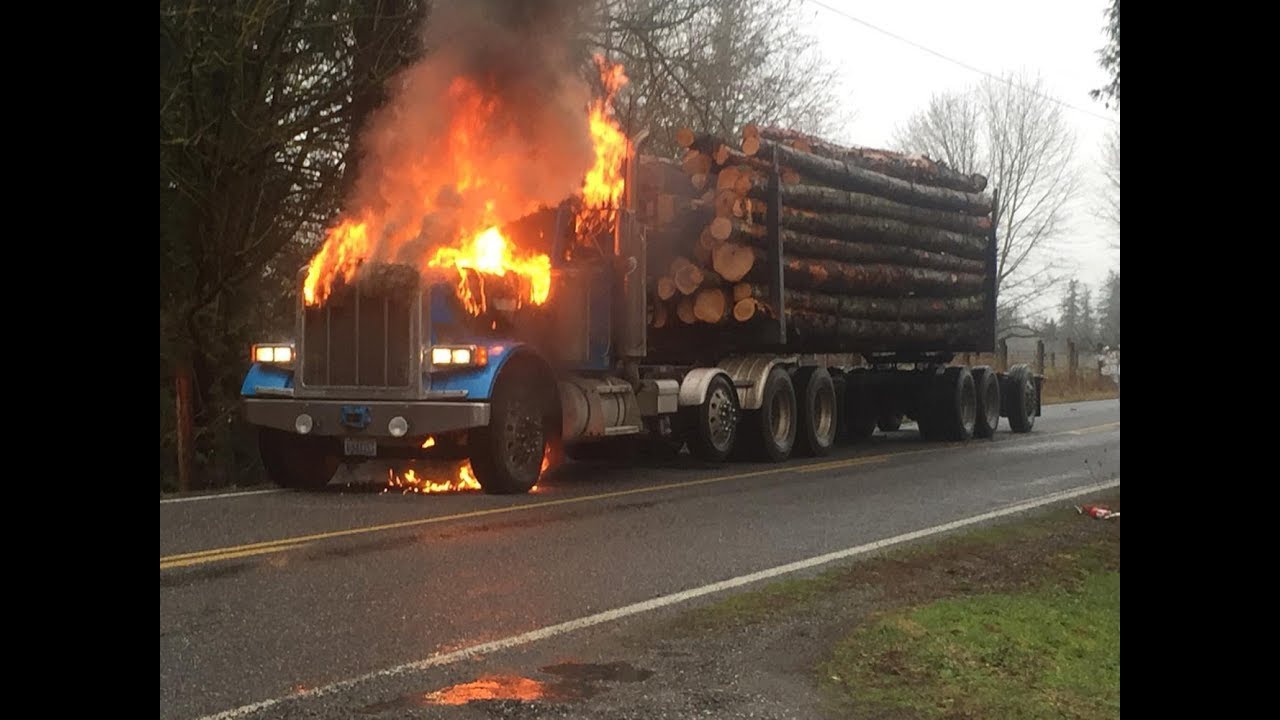 log truck driver narrowly escapes burning peterbilt logger youtube log truck driver