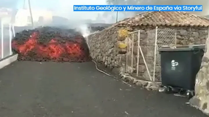 Lava oozes down streets, ignites homes in Spain af...