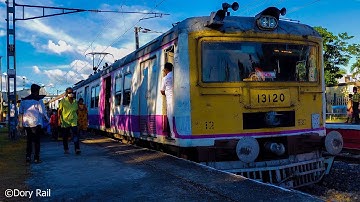In the beauty of light and colors the EMU local train entered dramatically on the station