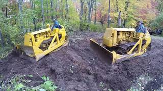 Two Caterpillar D2's Pushing Dirt and Filling Holes