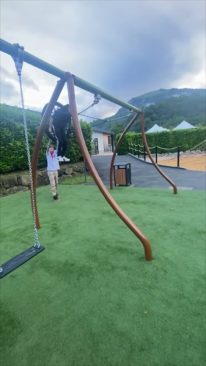 Boy Falls, Friend Gently Rocks Him on Swing