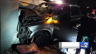 Pickup truck smashes into Lehigh Acres home with two vehicles parked in driveway