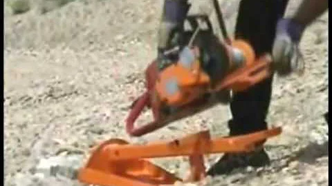 The Lewis Winch, a portable winch, uses the Ground Anchor to  pull a large rock